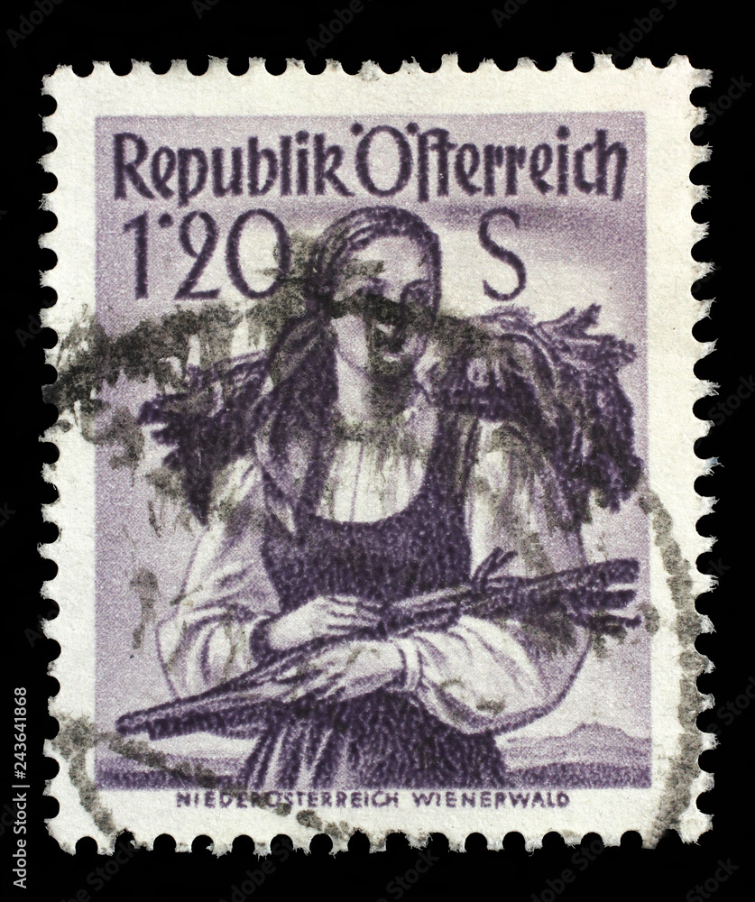 Stamp printed in Austria shows image woman in national Austrian costumes, Lower Austria, Wienerwald, series, circa 1949. Stamp printed in Austria shows image woman in national Austrian costumes, Lower Austria, Wienerwald, series, circa 1949.