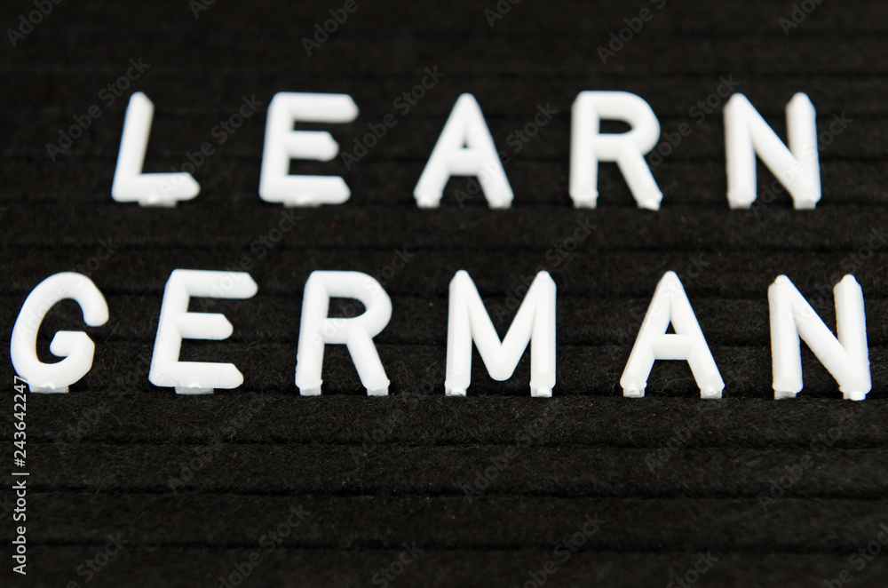 Learn German, GER abbreviation, simple sign on black background, great for teachers, schools, students Learn German, GER abbreviation, simple sign on black background, great for teachers, schools, students