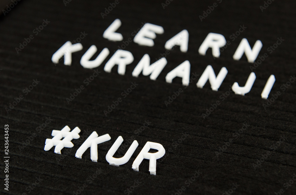 Fototapeta premium Learn Northern Kurdish Kurmanji language, KUR abbreviation, simple sign on black background, great for teachers, schools, students