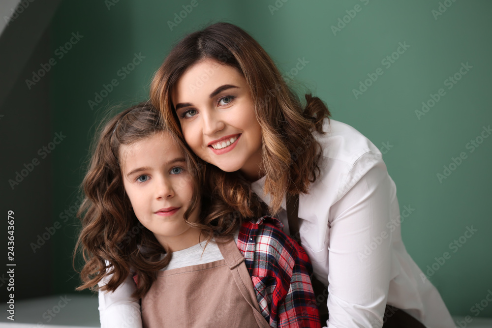 Portrait of beautiful young mother with cute daughter at home Portrait of beautiful young mother with cute daughter at home