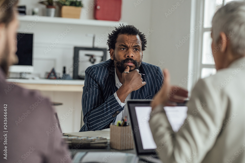 Multiethnic Group of Businesspeople on a Meeting