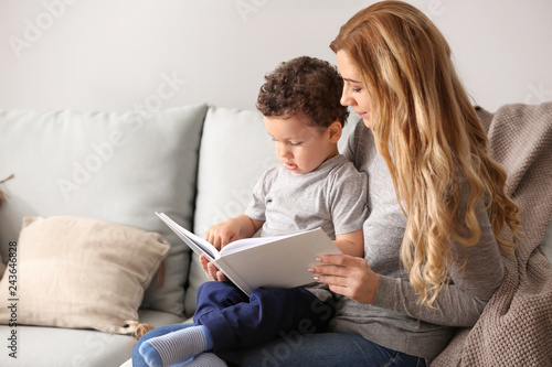Young mother with cute litt...