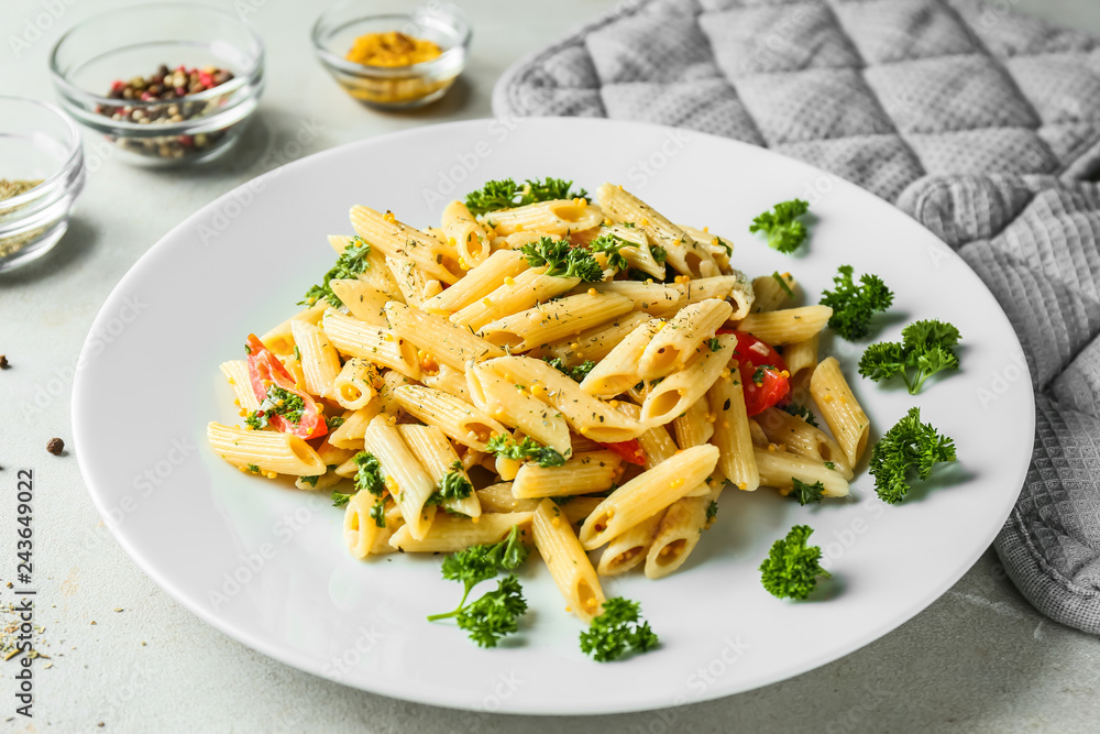 Tasty pasta with sauce and vegetables on plate