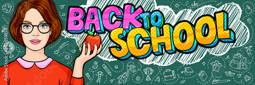 Young woman, teacher in front of a blackboard