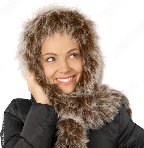 Pretty young woman in warm clothes isolated on white background