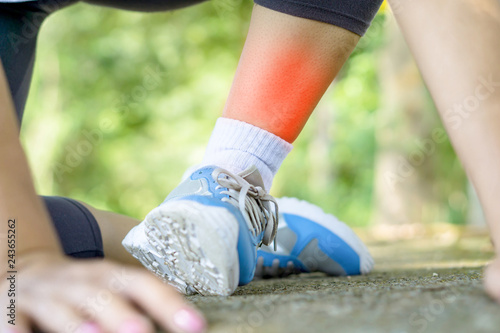 female runner falling during running having leg pain or twist ankle broken , 