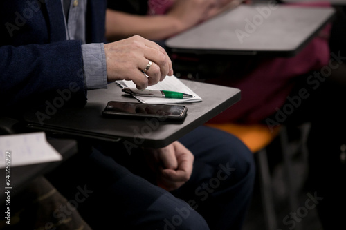 Journalist is taking notes during a conference