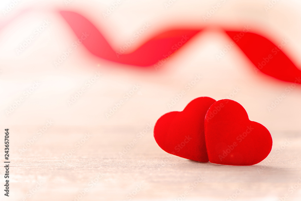 Fototapeta premium Concept of Valentine, anniversary, wedding celebration, heart shapes on a white wooden bench, bokeh background, close up