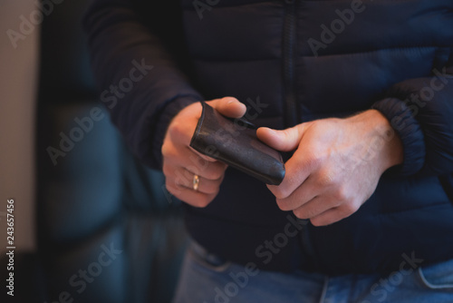 Businessman hands holding black wallet with coins money