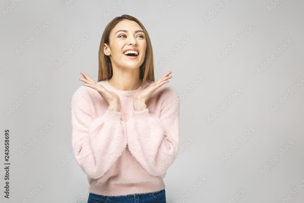 Beauty portrait of a sensual young woman with long red hair posing, holding hands at her face isolated over white background. Skin care concept. Beauty portrait of a sensual young woman with long red hair posing, holding hands at her face isolated over white background. Skin care concept.