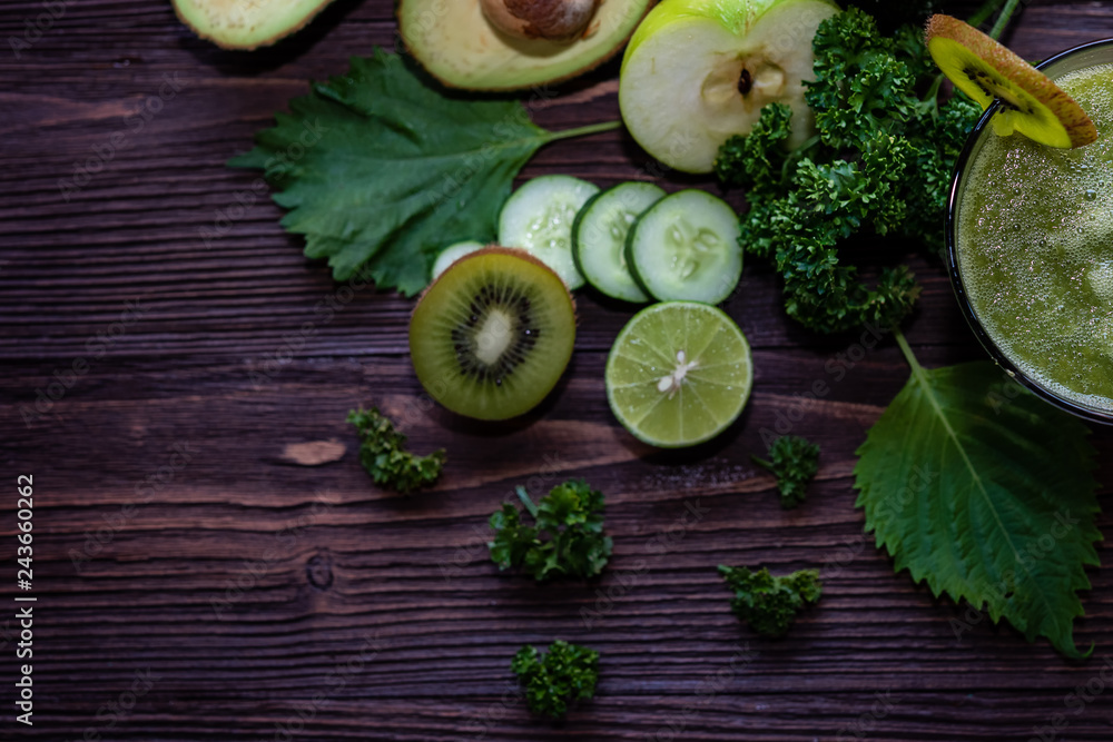 Healthy Juice. Green smoothie, Organic and Fresh green vegetable for detox, diet and weight loss on the wood background, top view and copy space.  Healthy Concept