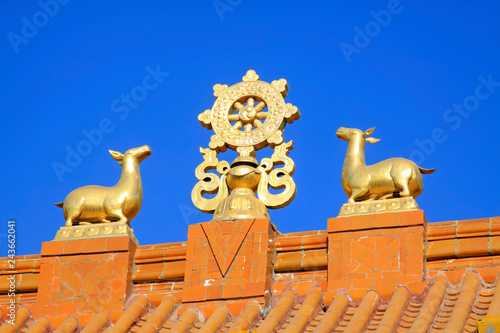 Gold and copper ornaments on the roof in a temple
