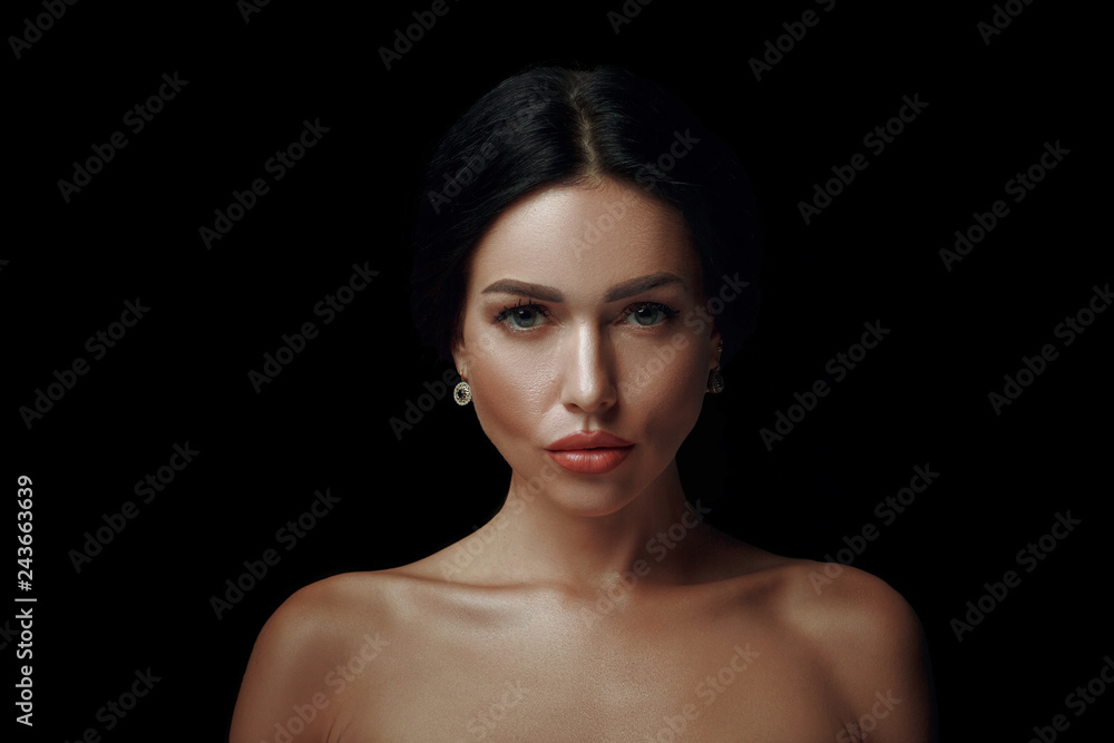 Closeup of a gorgeous woman on black background Closeup of a gorgeous woman on black background