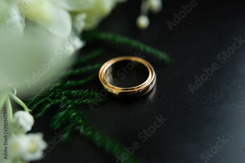 wedding rings on a dark background, Bridal bouquet, tulips