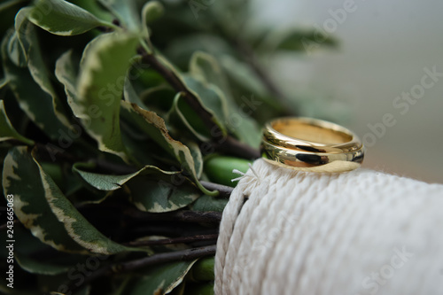 Fototapeta Naklejka Na Ścianę i Meble -  Wedding rings. Background the bride's bouquet