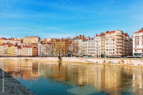 Facades of colorful traditional old houses along riverside, Lyon, France. © tiana__lima__