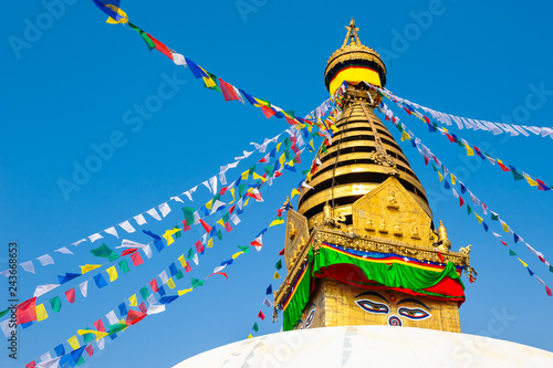 Stupa with colorful prayer flags in Swayambhunath Temple in Kathmandu, Nepal