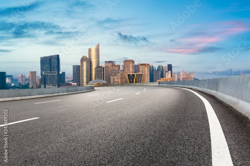 Empty asphalt road and city skyline at sunrise in hangzhou © ABCDstock