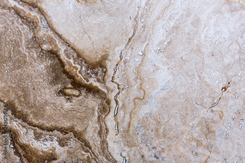 the texture of artificial marble is light natural beige with a beautiful pattern and dark inclusions. © Юлия Глазкова