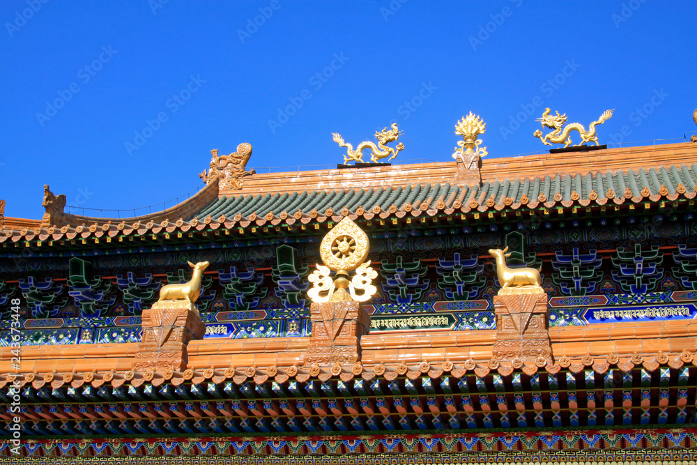 Glazed tile roof and Gilding copper Dharma chakra in a temple Glazed tile roof and Gilding copper Dharma chakra in a temple