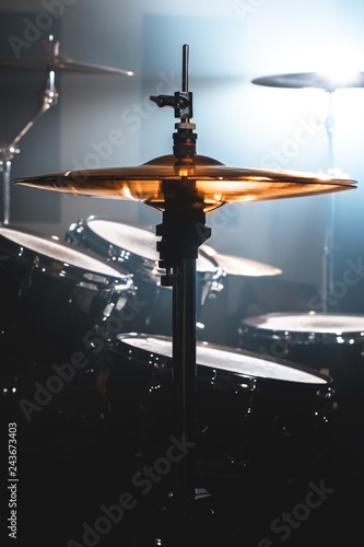 Canvas Print Close-up Drum set in a dark room against the backdrop of the spotlight