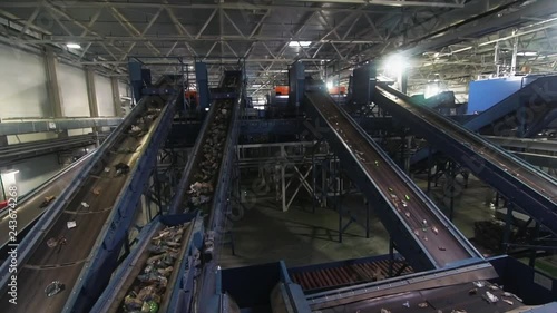 Waste processing plant. Waste on shipping tape. Waste sorting