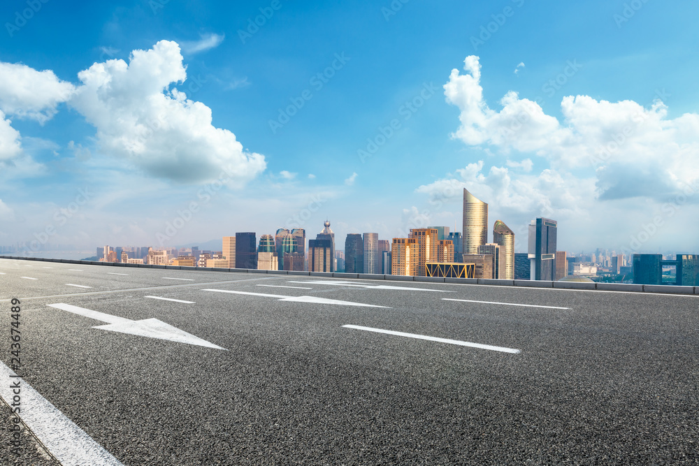Empty asphalt road and city skyline in Hangzhou,high angle view