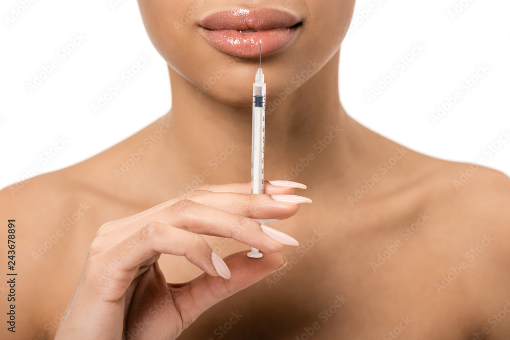 partial view of african american girl doing beauty injection in lips isolated on white