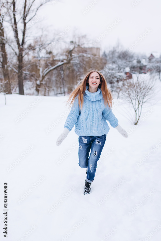 Close up winter portrait of young positive happy freedom hipster caucasian pretty fashionable girl outdoors in winter park smiling and having fun Close up winter portrait of young positive happy freedom hipster caucasian pretty fashionable girl outdoors in winter park smiling and having fun