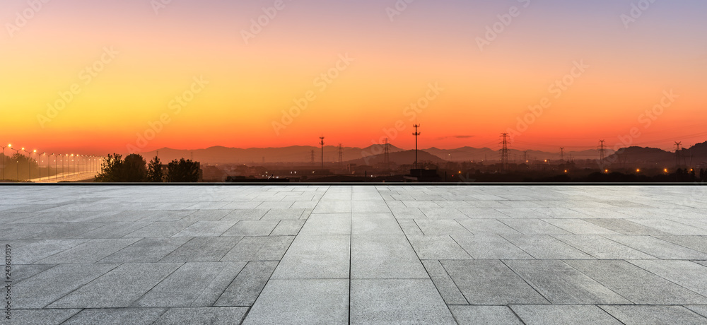 Empty square floor and hills at beautiful sunset