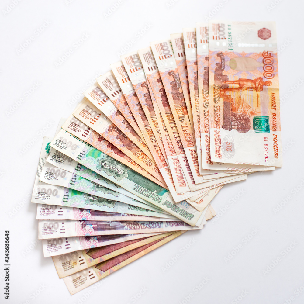 Russian money banknotes currency rouble on white isolated background. Loan, mortgage, credit concept Russian money banknotes currency rouble on white isolated background. Loan, mortgage, credit concept