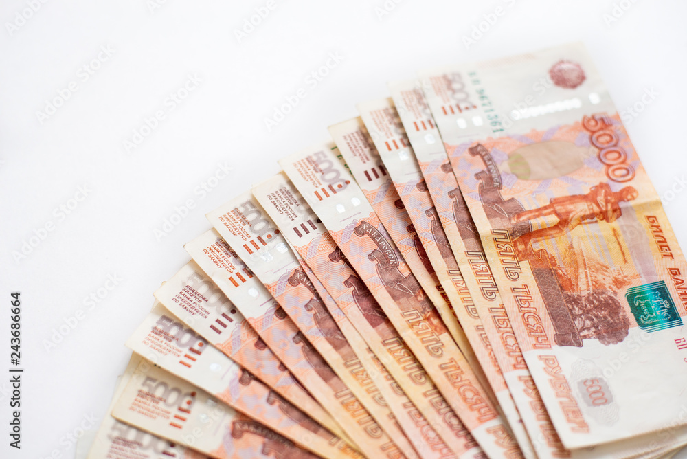 Russian rubles stock on white background, copy space. Loan, mortgage, credit concept Russian rubles stock on white background, copy space. Loan, mortgage, credit concept