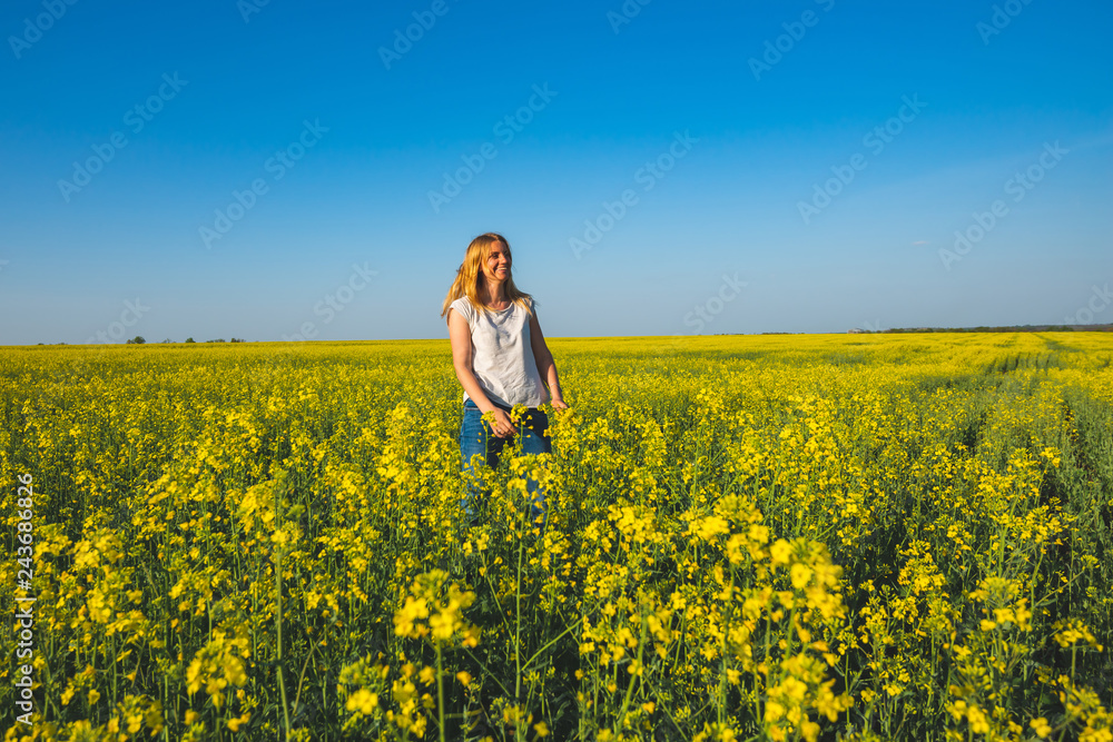 Joyful beautiful woman blonde walking on the field Joyful beautiful woman blonde walking on the field
