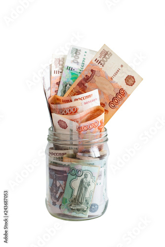 Russian money rubles in glass jar isolated on white background