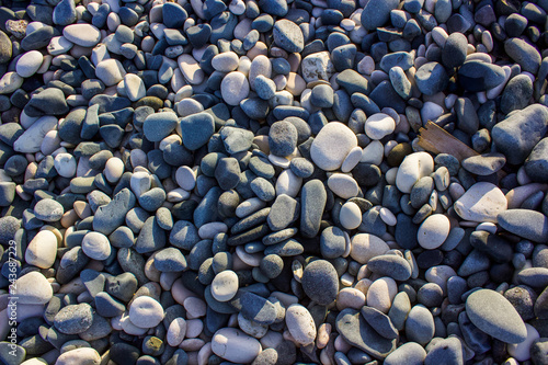 Pebbles for a natural beach pattern, tourism waiting for summer