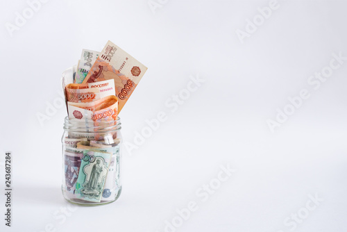 Loan, mortgage, credit, deposit, bank concept. Russian rubles in jar.