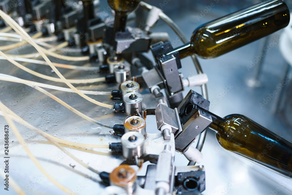 Fototapeta premium machine with tubes and bottles at factory