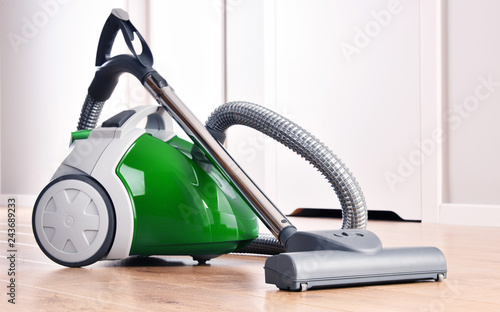 Konstfotografi Canister vacuum cleaner for home use on the floor panels