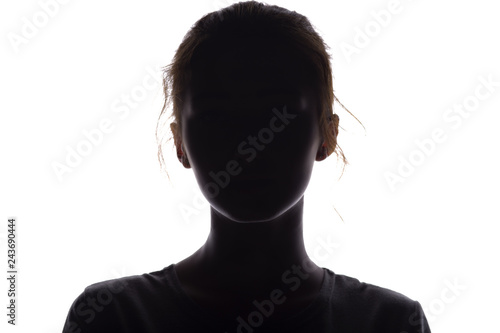 silhouette of a girl confidently looking forward, a young woman's head with a curl on a white isolated background