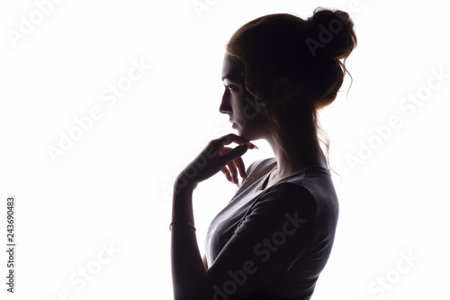 profile of a beautiful girl with chin hand contemptuously looking toward, confident young woman on a white isolated background