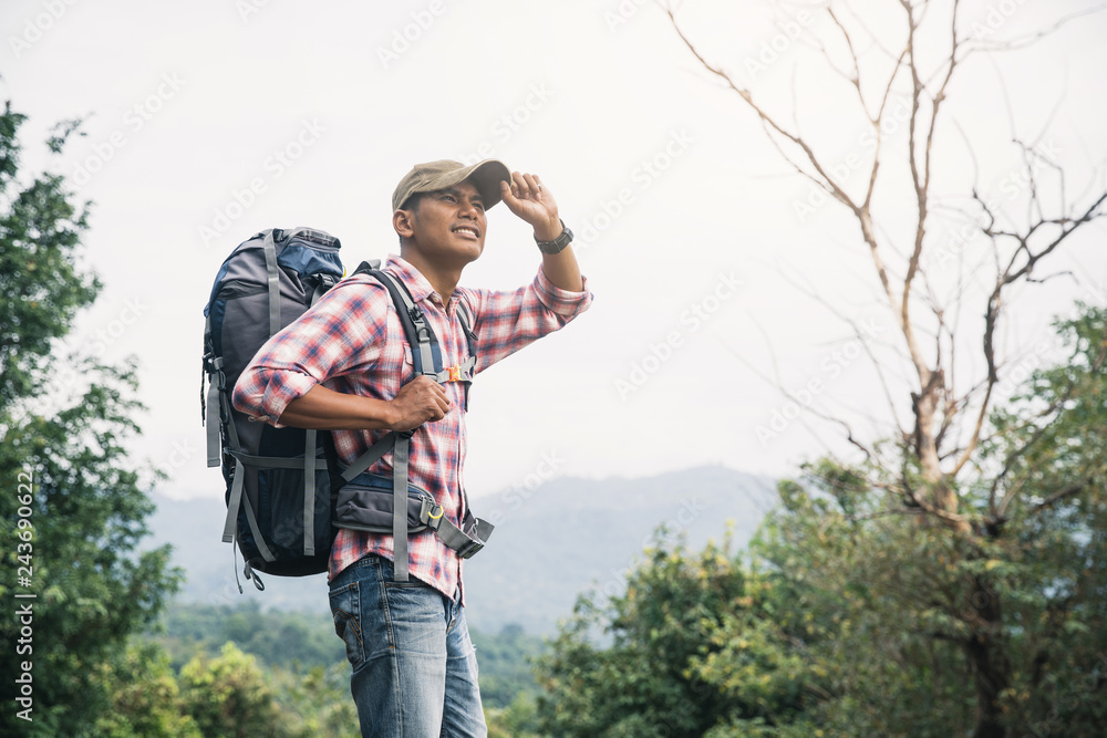 Man traveling with backpack hiking in mountains. Man backpacker hiking in  mountains alone outdoor active lifestyle travel adventure vacations. foto  de Stock | Adobe Stock