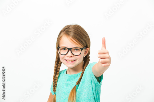 pretty girl with black glasses and plaits in front of white background in the studio