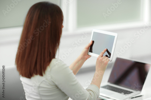 business woman with digital tablet in the workplace.