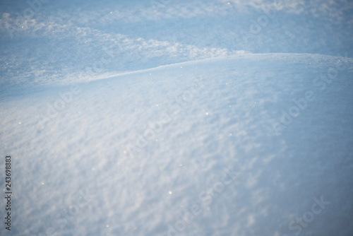 the natural background - snow surface in sunshine