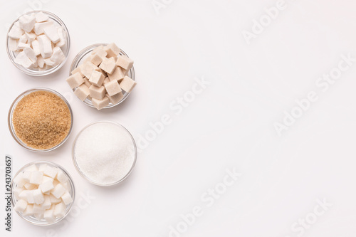 Фотография Various kinds of sugar cubes, pieces ands sand