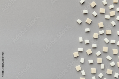 Refined white sugar pattern on gray background