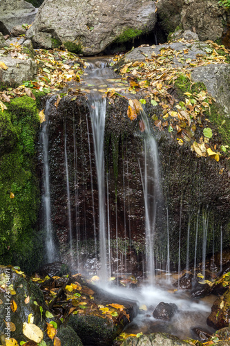 Autumn view of Samodivsko praskalo waterfall, Rhodope Mountains, Bulgaria photo