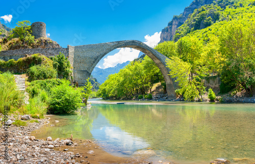 view of the old stoned bridge of Konitsa over the beautiful Aoos river, Zagori. Greece. Europe