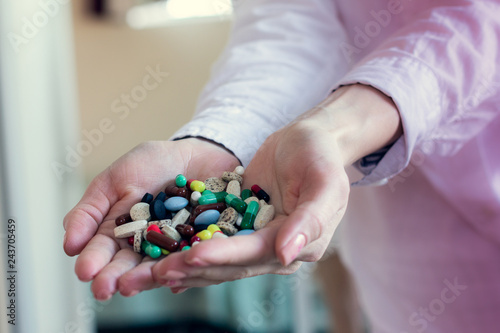 Wallpaper Mural colorful pills capsules in a doctor's hands Torontodigital.ca