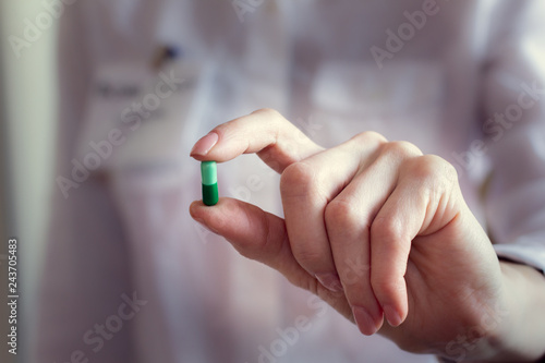 pill capsules in a doctor's hand